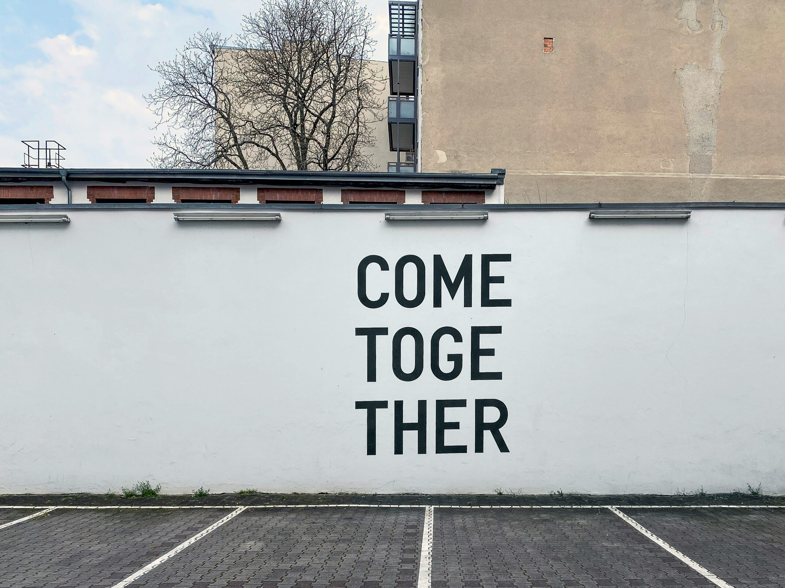 Image of "COME TOGETHER" mural for Blog post about how to make your brand more human