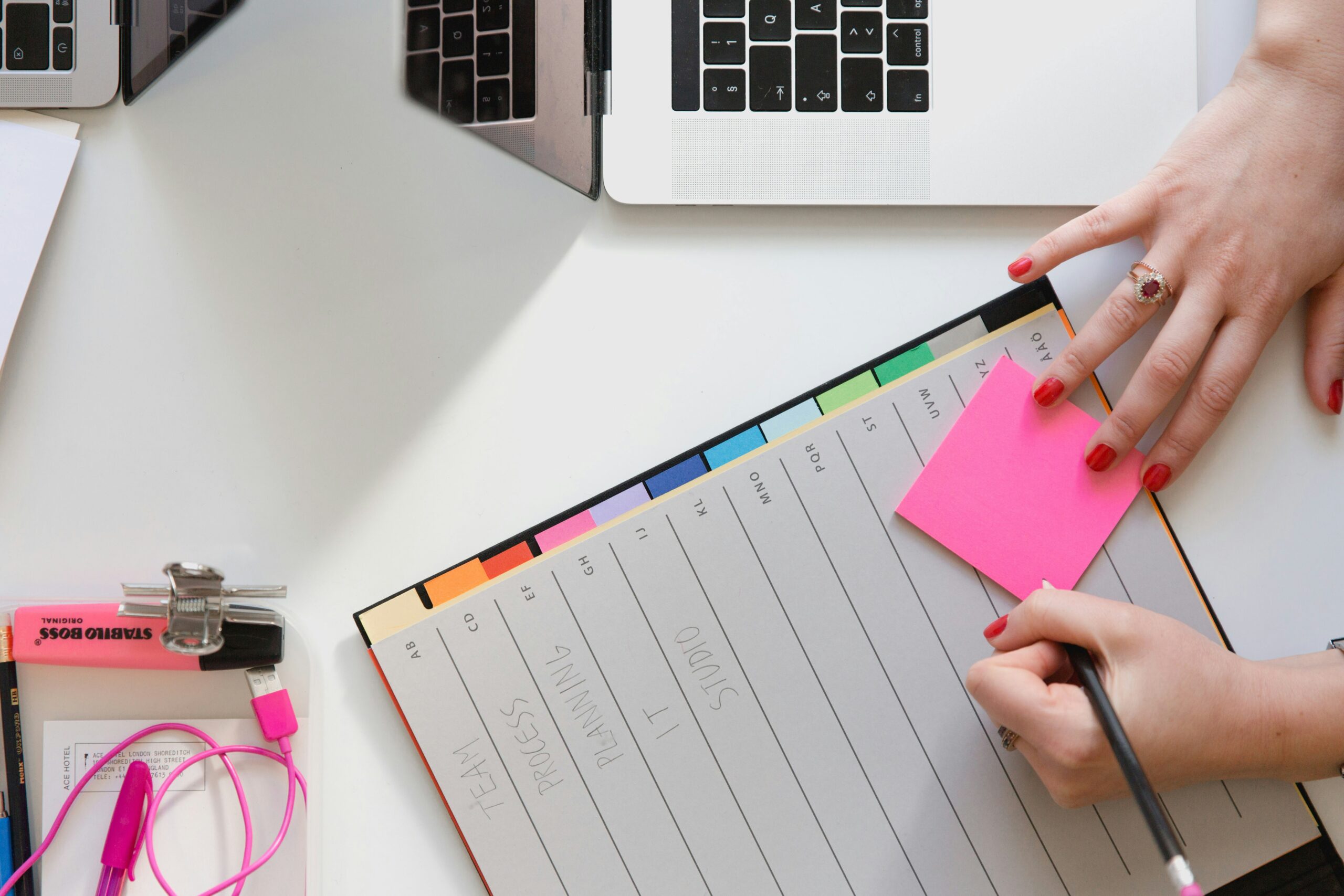 Image of colorful planner and laptop for Pinterest Marketing Strategy Blog Post